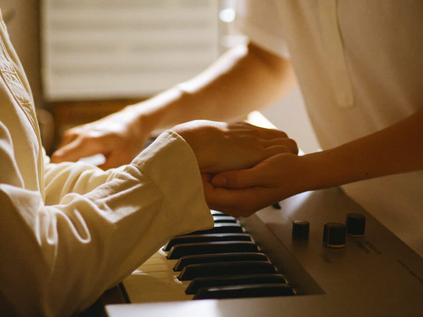 A trainer and learner making music together at MS Academy